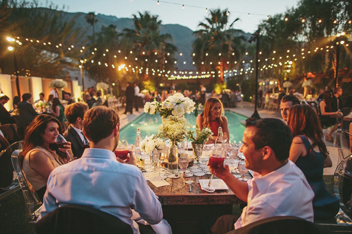 Reception at Alcazar pool with people drinking